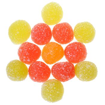 Heap multicolored candy top view isolated on a white background.