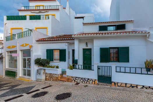 Street in the old town in the center of Lagos, Algarve region, Portugal. Narrow street in Lagos, Algarve, Portugal. Streets in the historic old town of Lagos, Algarve, Portugal.