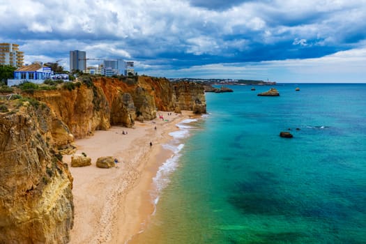 Praia dos Tres Castelos in south Portugal, Portimao, Algarve region. Landscape with Atlantic Ocean, shore and rocks in Tres Castelos beach (Praia dos Tres Castelos), Algarve, Portimao, Portugal.