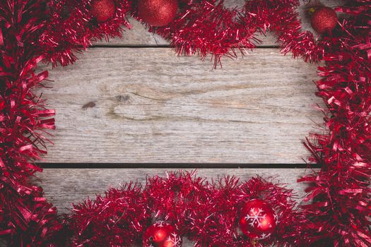 merry christmas concept with red decoration on old wooden board