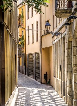 Ancient medieval narrow street in Girona. Spain. Catalonia.