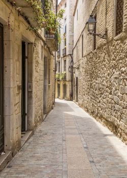 Ancient medieval narrow street in Girona. Spain. Catalonia.