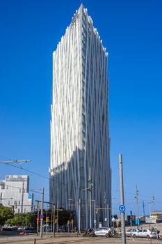 BARCELONA, SPAIN - JULY 12, 2016: New modern architecture in the Diagonal Mar i el Front Maritim del Poblenou area.

Barcelona, Spain - July 12, 2016: New modern architecture in the Diagonal Mar i el Front Maritim del Poblenou area. This is a new booming area with modern buildings. Diagonal Mar - District, built at the end of the past - the beginning of this century. The impetus for its development was the holding in the capital of Catalonia, the World Cultural Forum. Diagonal Mar is famous for its clean and tranquil beaches, upscale apartments and hotels. People are walking by street.