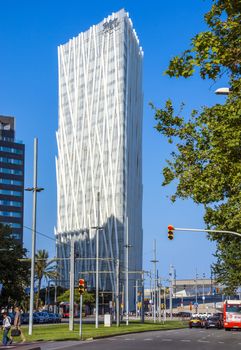 BARCELONA, SPAIN - JULY 12, 2016: New modern architecture in the Diagonal Mar i el Front Maritim del Poblenou area.

Barcelona, Spain - July 12, 2016: New modern architecture in the Diagonal Mar i el Front Maritim del Poblenou area. This is a new booming area with modern buildings. Diagonal Mar - District, built at the end of the past - the beginning of this century. The impetus for its development was the holding in the capital of Catalonia, the World Cultural Forum. Diagonal Mar is famous for its clean and tranquil beaches, upscale apartments and hotels. People are walking by street.