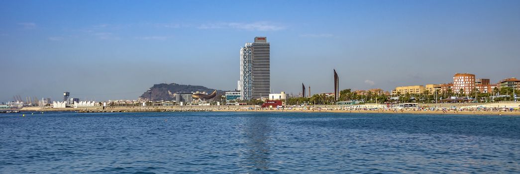 BARCELONA, SPAIN - JULY 2, 2016: Panoramic view of Barceloneta beach in Barcelona from sea

Barcelona, Spain - July 2, 2016: Panoramic view of Barceloneta beach in Barcelona from sea. People are resting on the beach.