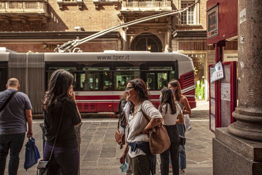 BOLOGNA, ITALY 17 JUNE 2020: People waiting bus in Bologna, Italy