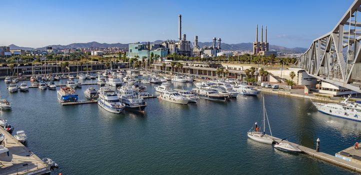 BARCELONA, SPAIN - JULY 3, 2016: The marina Port Forum in the north of Barcelona where lots of ships are moored. Nearby, a electricity plant what guaranties the energy supply of the City

Barcelona, Spain - July 3, 2016: The marina Port Forum in the north of Barcelona where lots of ships are moored. Nearby, a electricity plant what guaranties the energy supply of the City