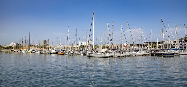 BARCELONA, SPAIN - JULY 4, 2016: Yachts and sailboats moored in the Port Vell of Barcelona, Catalonia, Spain

Barcelona, Spain - July 4, 2016: Yachts and sailboats moored in the Port Vell of Barcelona, Catalonia, Spain