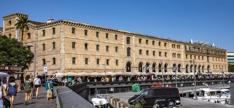 BARCELONA, SPAIN - JULY 4, 2016: Museum of History (Palau de Mar 1880-1890) in front of the harbor.

Barcelona, Spain - July 4, 2016: Museum of History (Palau de Mar 1880-1890) in front of the harbor. People are walking at the promenade.