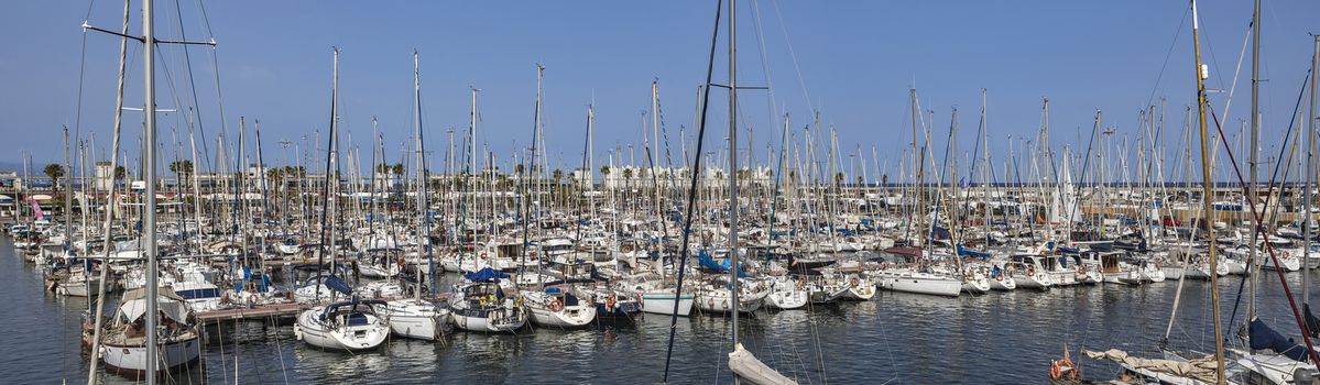 BARCELONA, SPAIN - JULY 4, 2016: Yachts and sailboats moored in the Port Vell of Barcelona, Catalonia, Spain

Barcelona, Spain - July 4, 2016: Yachts and sailboats moored in the Port Vell of Barcelona, Catalonia, Spain