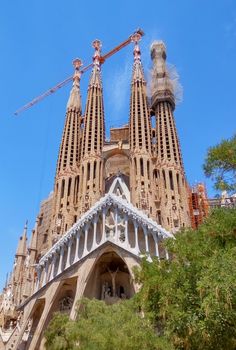BARCELONA, SPAIN - JULY 5, 2016: La Sagrada Familia - the impressive cathedral designed by Gaudi, which is being build since 19 March 1882 and is not finished yet.

Barcelona, Spain - July 5, 2016: La Sagrada Familia - the impressive cathedral designed by Gaudi, which is being build since 19 March 1882 and is not finished yet.