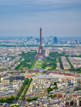 An aerial view of the Eiffel Tower and Paris, France at dusk.
