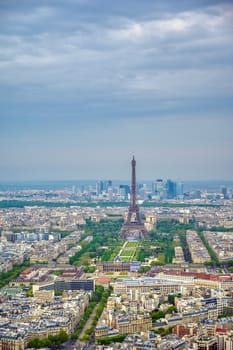 An aerial view of the Eiffel Tower and Paris, France at dusk.
