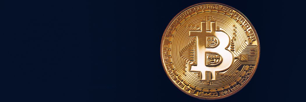 Crypto currency golden coin with bitcoin symbol on isolated on black background. Bitcoin Coin on black background. Bitcoin cryptocurrency.  Cryptocurrency Coin Concept.