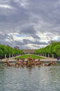 Versailles, France - April 24, 2019: Fountain of Apollo in the garden of Versailles Palace on a sunny day outside of Paris, France.