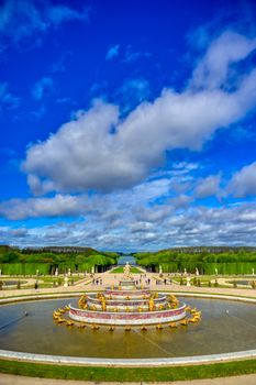 Versailles, France - April 24, 2019: Fountain of Latona in the garden of Versailles Palace on a sunny day outside of Paris, France.