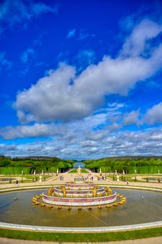 Versailles, France - April 24, 2019: Fountain of Latona in the garden of Versailles Palace on a sunny day outside of Paris, France.