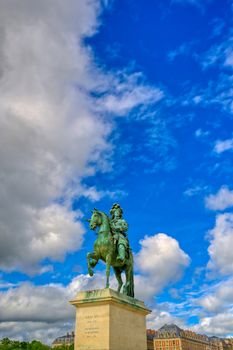 Versailles, France - April 24, 2019: Louis XIV statue just outside of the gates of Versailles Palace on a sunny day outside of Paris, France.