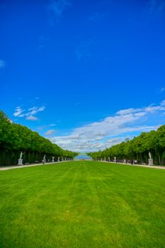 Versailles, France - April 24, 2019: The statues and fountains in and around the garden of Versailles Palace on a sunny day outside of Paris, France.