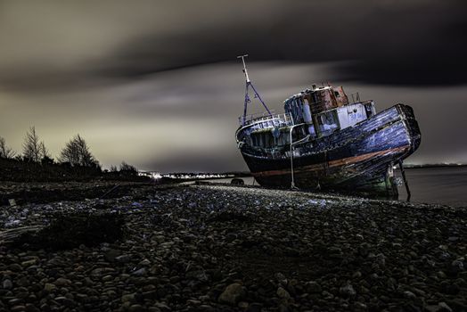 Glencoe, Scotland - Jan 2020: The Corpach Boat Wreck near Fort William, light painted night shot