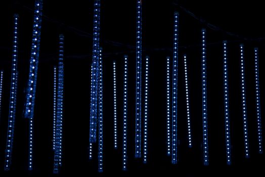 Nottigham, UK - Feb 2020: Bars of LED lights pulse to music as they sway onthe vbreeze as par of an installation at the annual festival of light