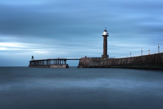 Whitby, Uk - Mar 2020: Long exposure of  the incoming tide near the pier at Whitby Bay