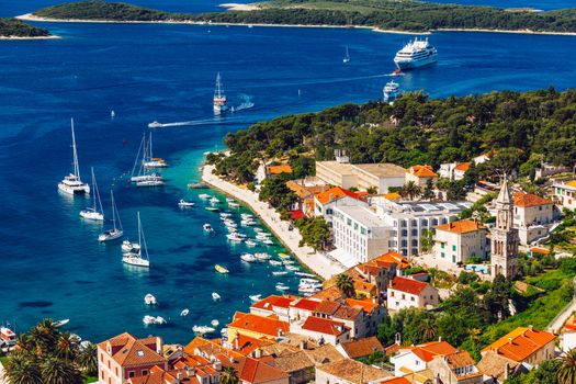 View at amazing archipelago with boats in front of town Hvar, Croatia. Harbor of old Adriatic island town Hvar. Popular touristic destination of Croatia. Amazing Hvar city on Hvar island, Croatia. 