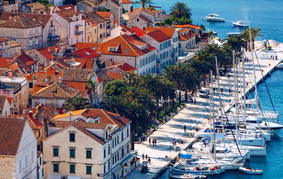 View at amazing archipelago with boats in front of town Hvar, Croatia. Harbor of old Adriatic island town Hvar. Popular touristic destination of Croatia. Amazing Hvar city on Hvar island, Croatia. 