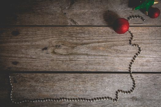 merry christmas concept with red decoration on old wooden board