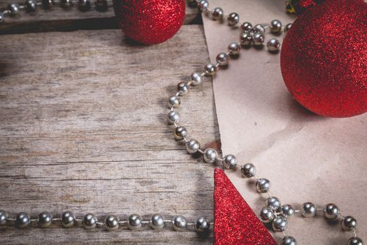 merry christmas concept with red decoration on old wooden board