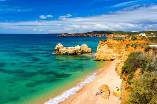 Praia dos Tres Castelos in south Portugal, Portimao, Algarve region. Landscape with Atlantic Ocean, shore and rocks in Tres Castelos beach (Praia dos Tres Castelos), Algarve, Portimao, Portugal.