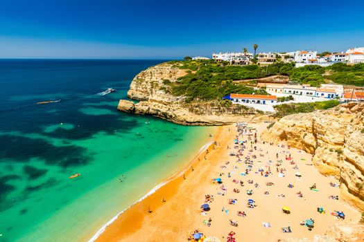 Benagil beach in Algarve region, Portugal, Europe. View of beach in Benagil fishing village on coast of Portugal. Praia de Benagil beach on atlantic coast, Algarve, Portugal.