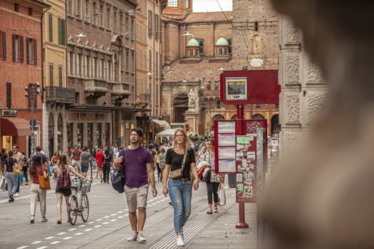 BOLOGNA, ITALY 17 JUNE 2020: People in Bologna walking on city center