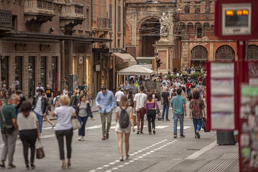 BOLOGNA, ITALY 17 JUNE 2020: People in Bologna walking on city center