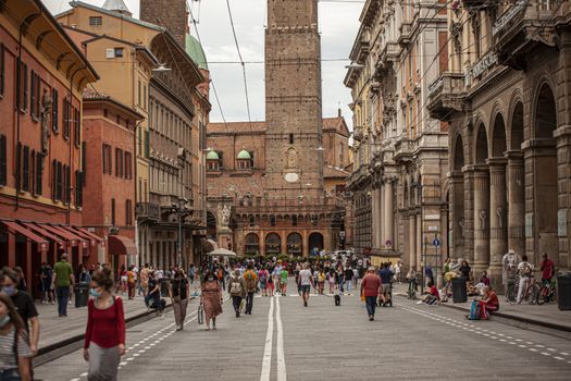 BOLOGNA, ITALY 17 JUNE 2020: Via Rizzoli in Bologna, Italy with his historical Building and the Asinelli Tower at the end