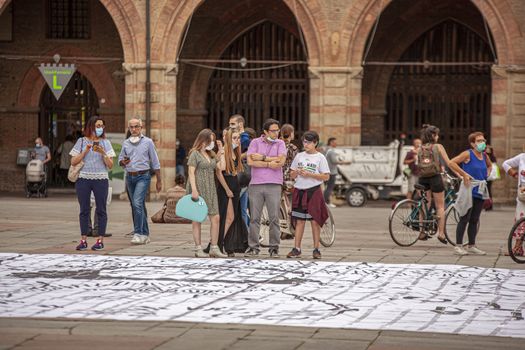 BOLOGNA, ITALY 17 JUNE 2020: People in Bologna walking on city center