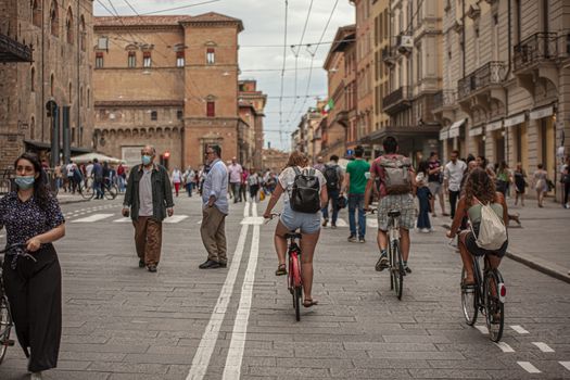 BOLOGNA, ITALY 17 JUNE 2020: People in Bologna walking on city center