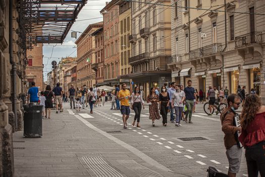 BOLOGNA, ITALY 17 JUNE 2020: People in Bologna walking on city center