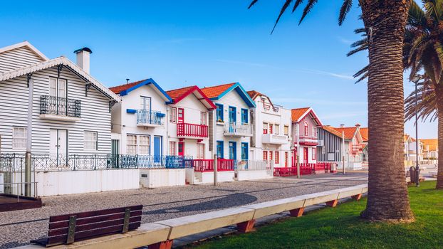Street with colorful houses in Costa Nova, Aveiro, Portugal. Street with striped houses, Costa Nova, Aveiro, Portugal. Facades of colorful houses in Costa Nova, Aveiro, Portugal.