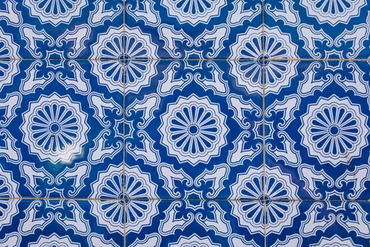 Azulejo is a form of Portuguese or Spanish painted, tin-glazed, ceramic tile work. Azulejos is traditional Portugese tiles in Aveiro. Architecture ornament. Aveiro, Portugal.