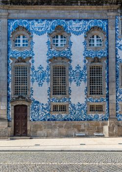 Traditional historic facade in Porto decorated with blue hand painted tin-glazed tiles, Oporto, Portugal