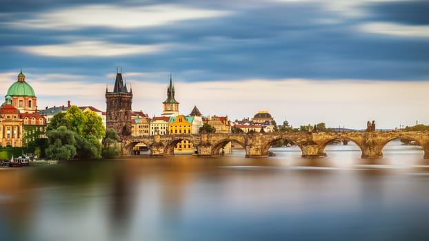 View of the Vltava River and the bridges shined with the sunset sun, Prague, the Czech Republic