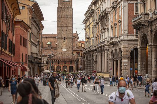 BOLOGNA, ITALY 17 JUNE 2020: People in Bologna walking on city center