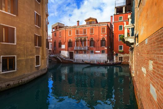 Canal with gondolas in Venice, Italy. Architecture and landmarks of Venice. Venice postcard with Venice gondolas.