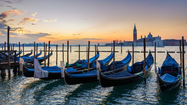 Sunrise in San Marco square, Venice, Italy. Venice Grand Canal. Architecture and landmarks of Venice. Venice postcard with Venice gondolas
