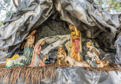 Garden Grove, California, USA - December 13, 2018: Crystal Christ Cathedral. Closeup of Statues in Nativity Scene for Christmas without baby Jesus but parents, animals and shepherds present.