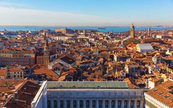 Venice panoramic aerial view with red roofs, Veneto, Italy. Aerial view of the Venice city, Italy. Venice is a popular tourist destination of Europe. Venice, Italy.