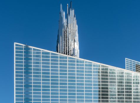 Garden Grove, California, USA - December 13, 2018: Crystal Christ Cathedral. Closeup of Church building and Crean Tower against blue sky.