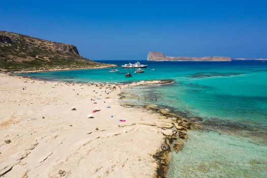 Amazing aerial panoramic view on the famous Balos beach in Balos lagoon and pirate island Gramvousa. Place of the confluence of three seas (Aegean, Adriatic, Libyan). Balos beach, Chania. Crete island. Greece. Europe.