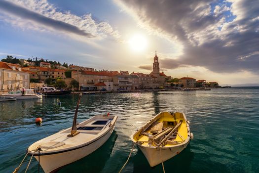 Fishing boat anchoring in beautiful Sutivan port, Brac island, Croatia. Sutivan on Island Brac in Croatia. Made of well known white limestone. Port with fishing boats. Sutivan, Brac, Croatia.